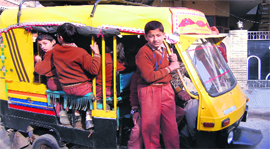 Flouting traffic rules auto-rickshaw drivers overload their vehicles while ferrying school children to and from schools in Jalandhar.