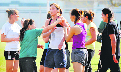 Players of Turkmenistan kabaddi team help a teammate who pulled a muscle during a practice session at Guru Nanak Stadium in Ludhiana on Sunday.