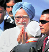 PM Manmohan Singh meets party supporters in Vasda, Gujarat, on Sunday.