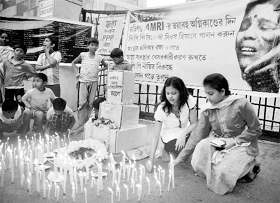 To mark the first anniversary of the AMRI fire incident that claimed the lives of 94 patients, people light candles in front of AMRI hospital in Kolkata on Sunday evening.