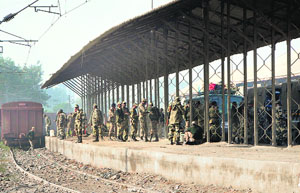 Armymen take a break at the Attari station which otherwise remains deserted these days.