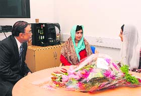 Pakistan President Asif Ali Zardari with Malala Yousufzai, the Pakistani schoolgirl who was shot by the Taliban, at the Queen Elizabeth Hospital in Birmingham, central England, on Saturday