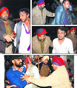 Policemen nab assailants from a marriage palace; and (right) shopkeeper and TV reporter Ashwani Malhotra sustains injuries in the attack at Bhagat Singh Chowk in Jalandhar on Monday.
