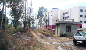 Land belonging to the District Hospital without a boundary wall in Rajouri. 