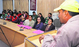 A speaker delivers a lecture during a symposium on the theme Youth on the Move in Jammu on Monday. 