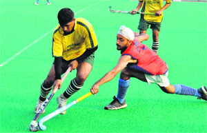 Players in action during the All India Police Hockey Championship at the KK Hakhu Stadium in Jammu on Monday. 