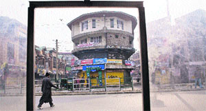 A man walks past closed shops at Lal Chowk in Srinagar after a strike was called by the Jammu and Kashmir Liberation Front on Monday.