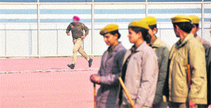 A policeman was made to run on the synthetic track at the Guru Nanak Stadium in Ludhiana on Monday. 