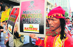 Indigenous people from Mindanao towards the Presidential Palace to rally as they commemorate International Human Rights Day in Manila on Monday. The protesters are calling out the Aquino administration as the number one human rights violator. 