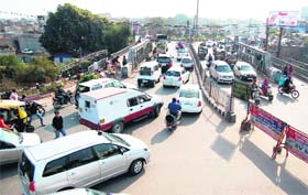 A heavy rush of vehicles on Bhandari bridge in Amritsar on Tuesday
