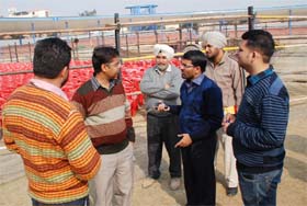Officials of the district administration review the arrangements at the stadium