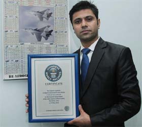 Muhammad Faisal with his certificate