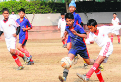Players in action during a football match for the St Kabir Soccer Trophy in Chandigarh on Tuesday. tribune photo: manoj mahajan