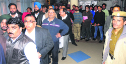 Applicants await their turn for the leftover vanity numbers at the office of the Registration and Licensing Authority in Sector 17, Chandigarh, on Tuesday. tribune photo: s chandan