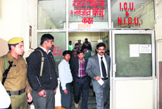 A policeman stands guard at the ICU of Sunrise Hospital in Gurgaon where two patients were shot at on Tuesday.