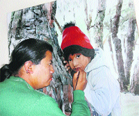 Mukesh engrossed in painting. Photo by writer