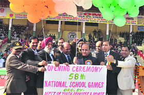 Deputy Chief Minister Tara Chand, along with other officials, inaugurates the 58th National School Games in Jammu on Tuesday.