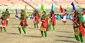 Girls give a dance performance during the inaugural function at MA Stadium in Jammu on Tuesday.