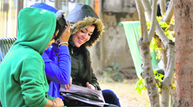 PAU students bask under the sun that played hide and seek in Ludhiana on Tuesday.