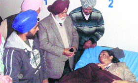 Raikot MLA Gurcharan Singh Boparai meets the acid attack victim at a hospital in Raikot on Tuesday.