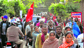 Members of the mazdoor union stage a dharna outside the Police Commissioners office in Ludhiana.