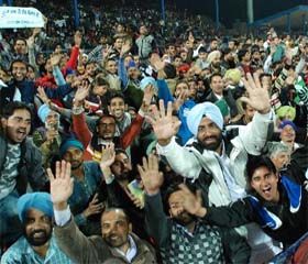 A jubilant crowd watches the semi-final matches at the multi-purpose stadium on Wednesday evening