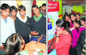 Students pose queries on HIV at a counselling centre onboard the train; and (right) students inside a coach of the train.