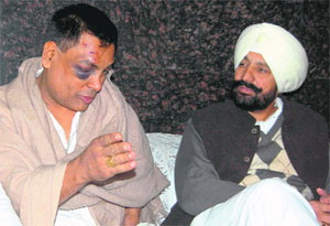 MLA Balbir Singh Sidhu (right) with the victim, Subhash Sharma, in Mohali on Wednesday. 