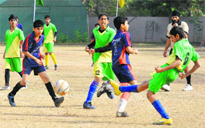 Players in action during a semifinal match between St Kabir School and St Xaviers School in Chandigarh on Wednesday.