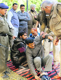 The police removes protesters who staged a dharna in front of the Punjab Raj Bhawan in Chandigarh on Wednesday