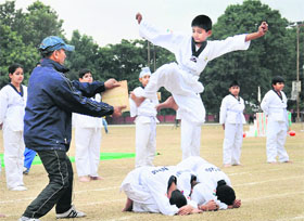 A student of Vivek High School, Mohali, shows his skills during a tae kwon do event at the Sector 46 sports complex in Chandigarh on Thursday.