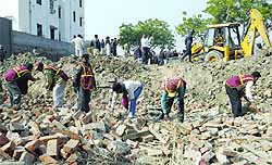 Rescue workers remove debris