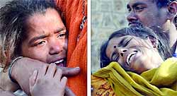 Relatives mourn the death of five children who died in the wall collapse in East Delhi on Wednesday