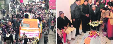 The funeral procession of first Chief Minister of Uttarakhand Nityanand Swami being taken out in Dehradun on Wednesday; and (right) Chief Minister Vijay Bahuguna and Finance Minister Indira Hridayesh pay floral tributes to the departed soul