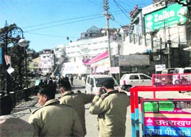 Policemen enforce the one-way traffic plan on Mall Road in Mussoorie on a trial basis