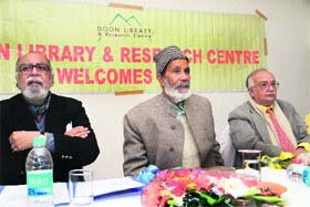 Environmentalist Chandi Prasad Bhatt (centre), former Chief Secretary Indu Kumar Pandey (right) and Rajen Brijnath, adviser, Doon Library, at a function on World Mountain Day in Dehradun