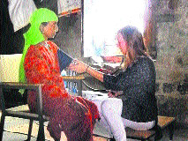 A woman being examined by a doctor under the NRHM programme.
