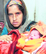 Seema with her daughter who was born on 12/12/12 at Guru Nanak Ashram, Rama Mandi, Jalandhar, on Wednesday. Tribune photo: Sarabjit Singh