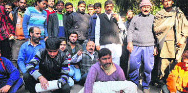 Family members of the deceased infant, Baby, hold a protest at SMGS Hospital in Jammu on Wednesday. 