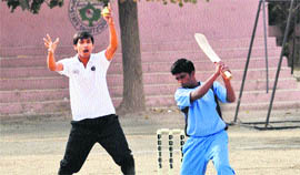 Players in action during the Tennis Ball Cricket Championship in Jammu on Wednesday.