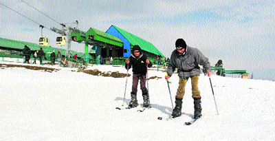 Two skiers enjoying the slopes of Gulmarg, 55 km north of Srinagar, on Wednesday.