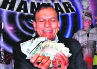 Magician Samrat Shankar shows a magic trick in Haridwar on Thursday. 