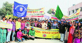 Dr Asha Kadian, registrar, Khanpur Women University, flags off an awareness rally of NSS volunteers from the university premises.