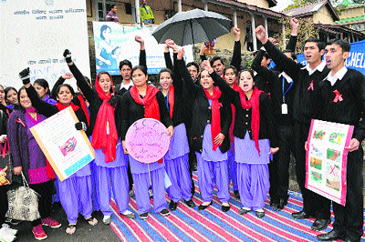 Volunteers from the Gian Jyoti BEd College enact a street play on HIV-AIDS awareness in Dharamsala on Thursday.