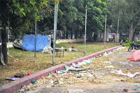 Garbage strewn across a lawn after a mega show in Kala Kendra in Jammu on Thursday