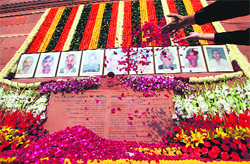 A security personnel pays tributes to the martyrs of the 2001 Parliament attack on its 11th anniversary in New Delhi on Thursday.