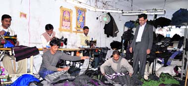 Workers at a hosiery unit in Ludhiana on Thursday. 