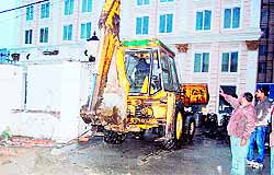 An MC team during the anti-encroachment drive in Hall Bazaar in Amritsar on Friday