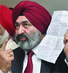 Jasjit Singh, president of the Shiromani Akali Dal (Delhi-UK) with Sukhbeer Singh Kalra (L), senior vice-president, addressing a press conference ahead of the forthcoming DSGMC election in New Delhi on Friday.