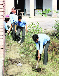 Students of Senior Secondary School at Sisana village of Sonepat district are engaged in manual labour during school hours.